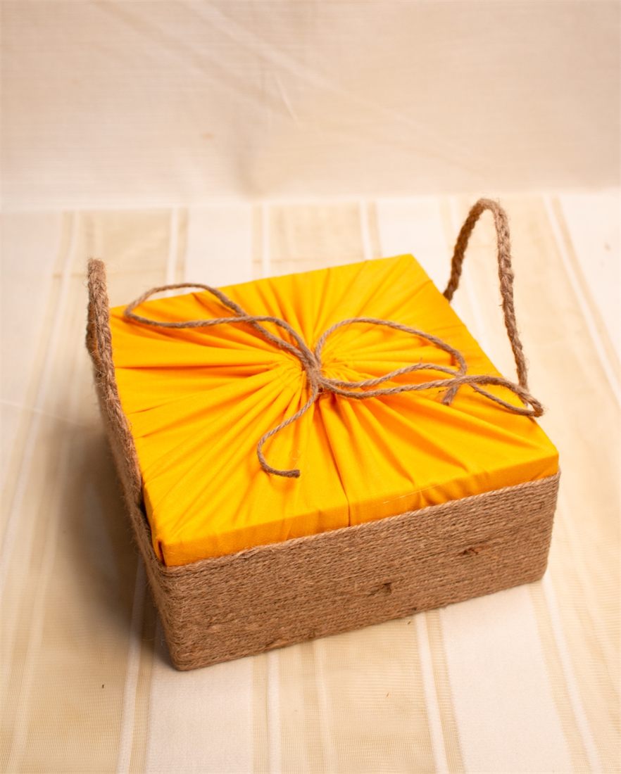 Jute gift box with yellow wrap and twine bow