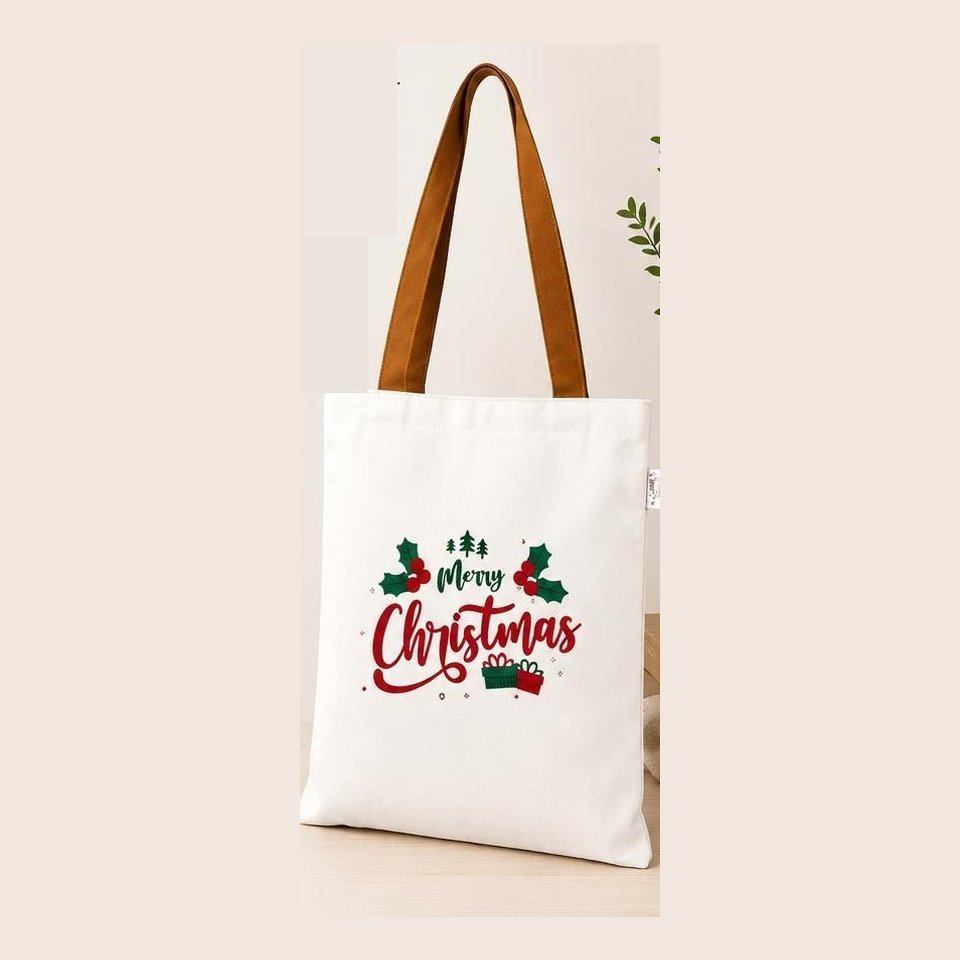 White poly-canvas tote with red and green Merry Christmas print and tan handles